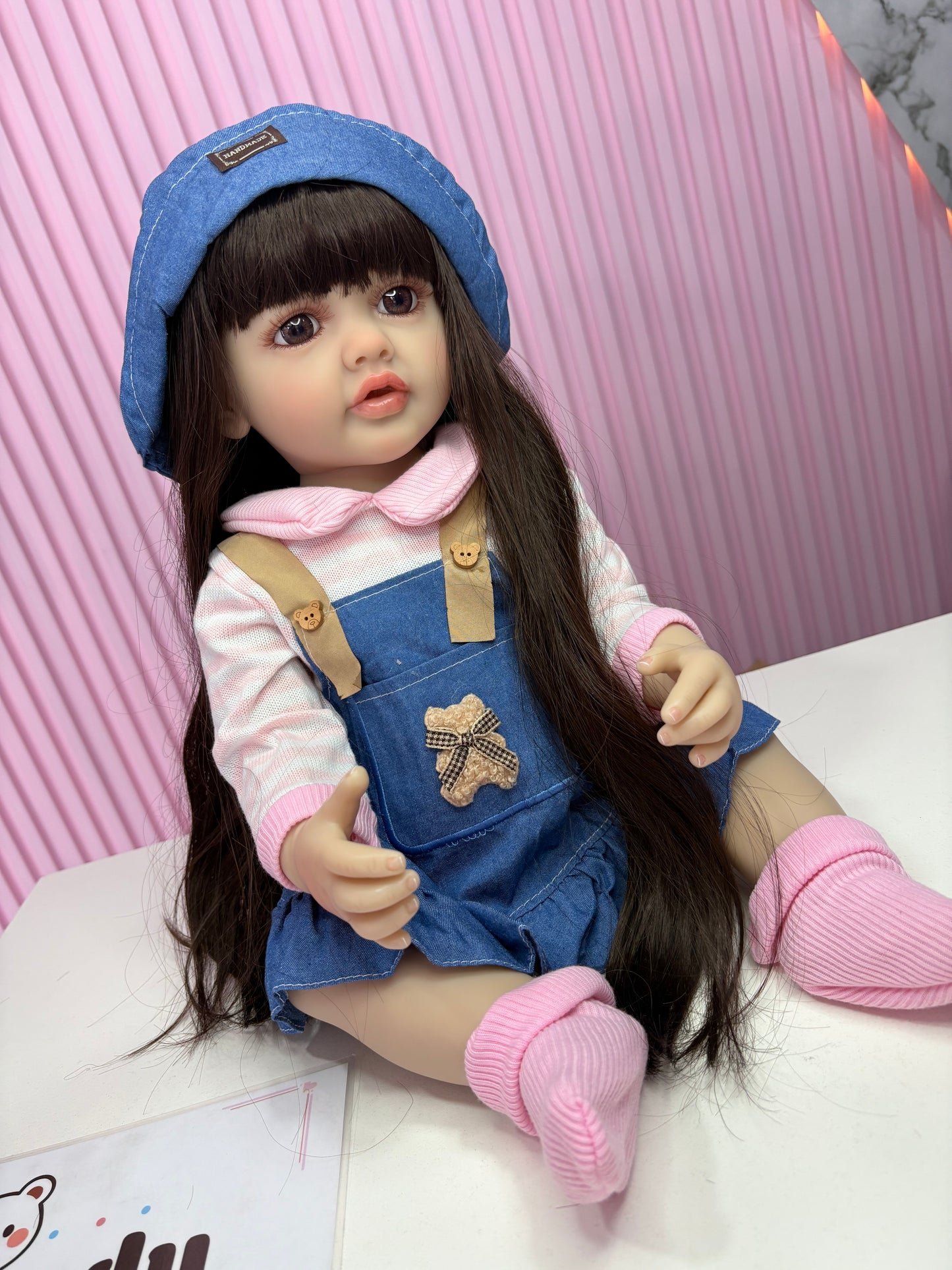 Niña Reborn mezclilla 55cm vinilo