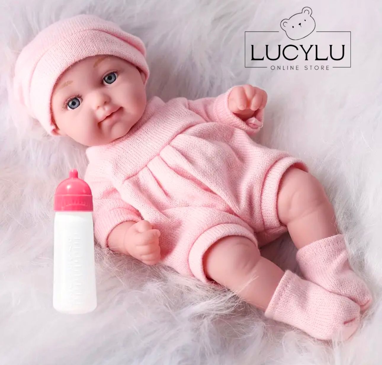 Muñeca con biberón 28cm